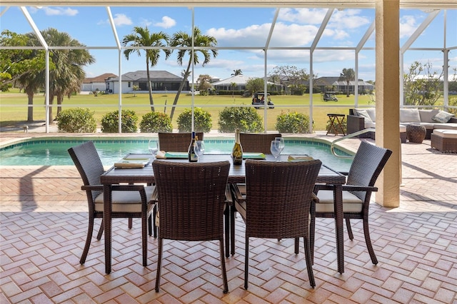 outdoor pool with an outdoor living space, a patio, a lanai, and a residential view
