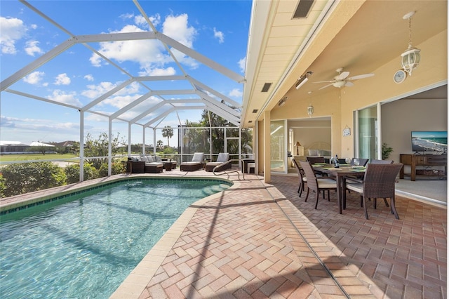 swimming pool featuring outdoor lounge area, a patio area, a ceiling fan, outdoor dining space, and glass enclosure