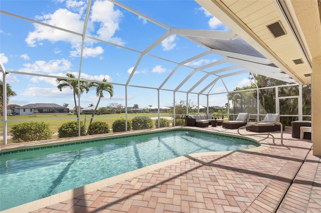 swimming pool featuring a patio area, an outdoor hangout area, and glass enclosure