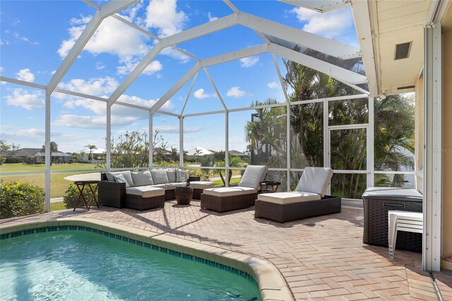 outdoor pool featuring an outdoor hangout area, a patio area, and a lanai