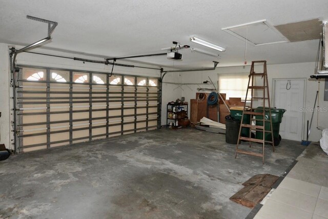 garage featuring a garage door opener