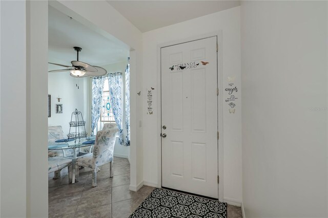 15050 Sandpiper Preserve Blvd Unit 101, Fort Myers, FL 33919 - entryway featuring light tile patterned floors, baseboards, and a ceiling fan
