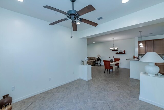 15050 Sandpiper Preserve Blvd Unit 101, Fort Myers, FL 33919 - living room with baseboards, recessed lighting, visible vents, and ceiling fan with notable chandelier