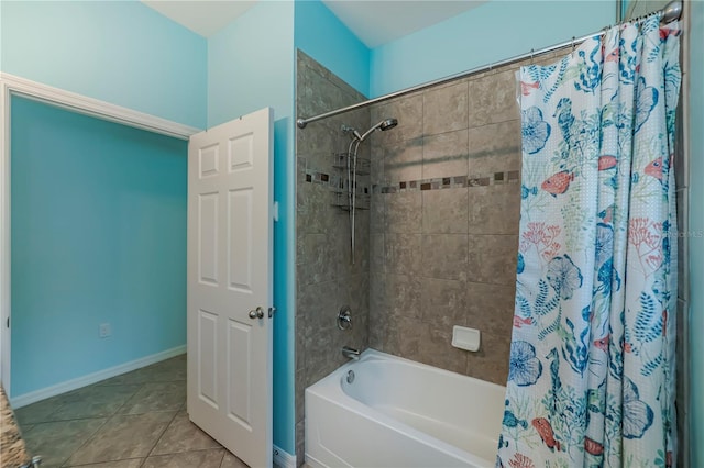 15050 Sandpiper Preserve Blvd Unit 101, Fort Myers, FL 33919 - bathroom featuring tile patterned floors, shower / bathtub combination with curtain, and baseboards