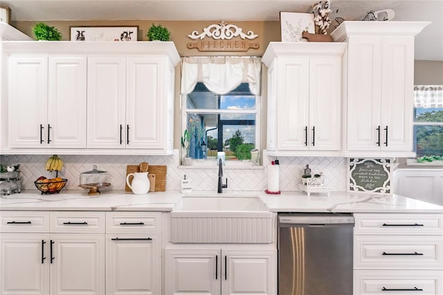7192 SW Albritton St, Arcadia, FL 34266 - kitchen with dishwasher, a sink, tasteful backsplash, white cabinetry, and light countertops
