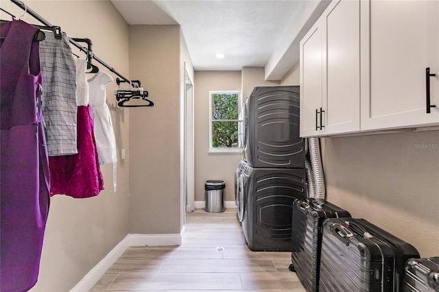 7192 SW Albritton St, Arcadia, FL 34266 - washroom with stacked washer / drying machine, cabinet space, light wood finished floors, baseboards, and recessed lighting
