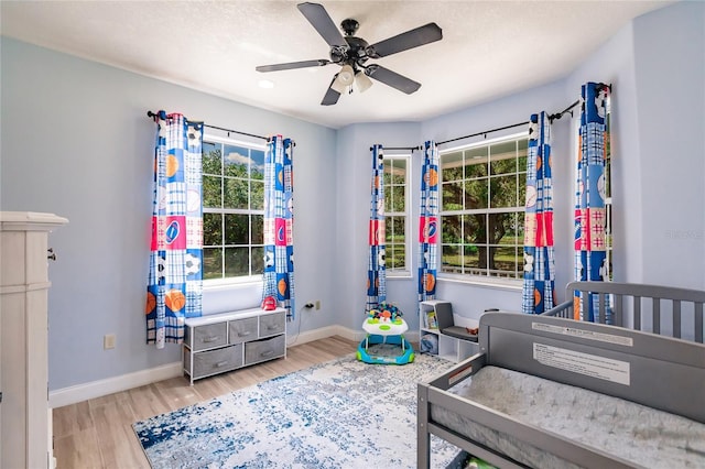 7192 SW Albritton St, Arcadia, FL 34266 - bedroom featuring baseboards, light wood-style flooring, and a ceiling fan