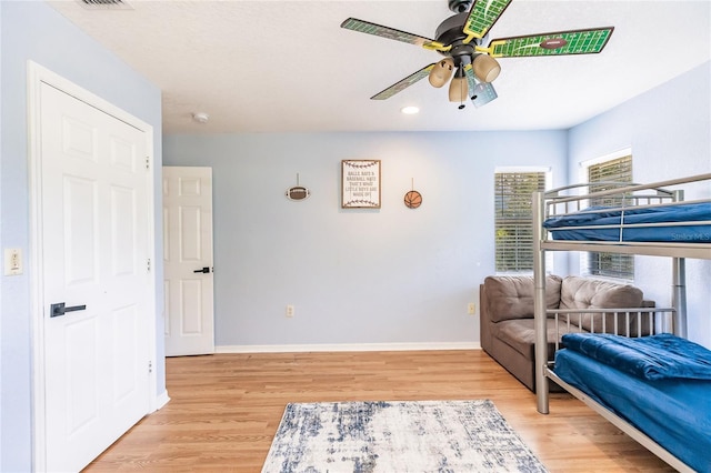 7192 SW Albritton St, Arcadia, FL 34266 - bedroom with light wood-style floors, baseboards, and ceiling fan