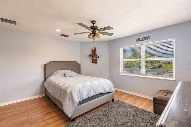 7192 SW Albritton St, Arcadia, FL 34266 - bedroom featuring baseboards, light wood finished floors, a ceiling fan, recessed lighting, and a textured ceiling
