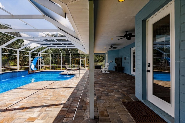7192 SW Albritton St, Arcadia, FL 34266 - swimming pool with a patio, a ceiling fan, a water slide, and glass enclosure