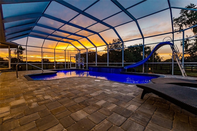 7192 SW Albritton St, Arcadia, FL 34266 - outdoor pool featuring a water slide, a patio area, and a lanai