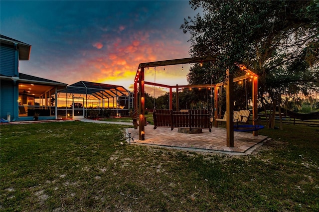 7192 SW Albritton St, Arcadia, FL 34266 - yard at dusk featuring a patio, a yard, and a lanai