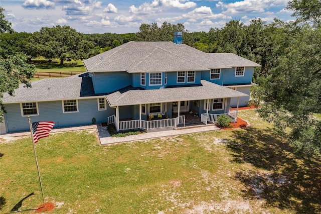 7192 SW Albritton St, Arcadia, FL 34266 - view of front facade with a porch, a front lawn, and a shingled roof