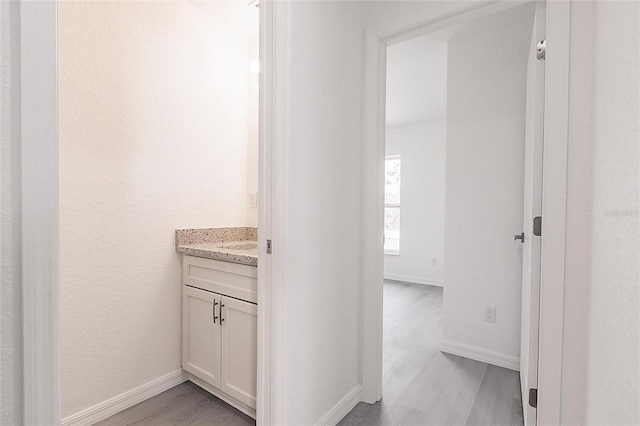 27438 Corinthian Dr, Punta Gorda, FL 33955 - hallway with light wood finished floors and baseboards