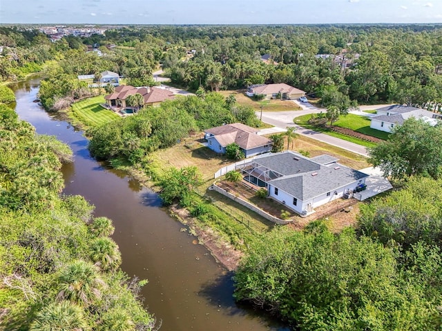 3027 Ridgewood Dr, North Port, FL 34287 - drone / aerial view of a heavily wooded area and a large body of water