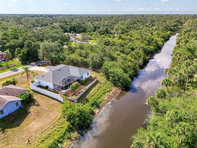 3027 Ridgewood Dr, North Port, FL 34287 - view from above of property with a heavily wooded area and a large body of water