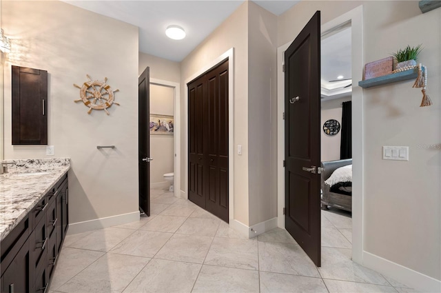 3527 NW 8th Ter, Cape Coral, FL 33993 - bathroom featuring vanity, a closet, and ensuite bathroom