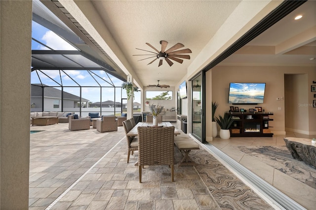 3527 NW 8th Ter, Cape Coral, FL 33993 - view of patio / terrace with an outdoor living space, a ceiling fan, and a lanai