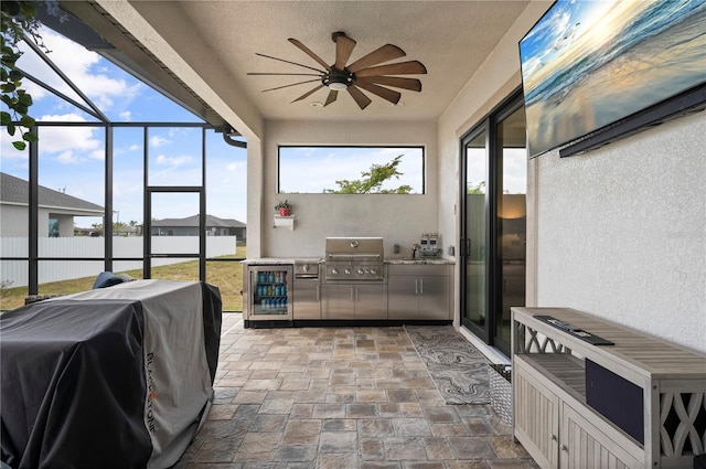 3527 NW 8th Ter, Cape Coral, FL 33993 - sunroom featuring area for grilling, a ceiling fan, and wine cooler