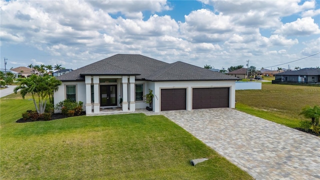 3527 NW 8th Ter, Cape Coral, FL 33993 - view of front facade featuring a garage, stucco siding, a front yard, decorative driveway, and a shingled roof