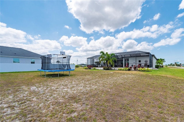 3527 NW 8th Ter, Cape Coral, FL 33993 - view of green lawn featuring a trampoline