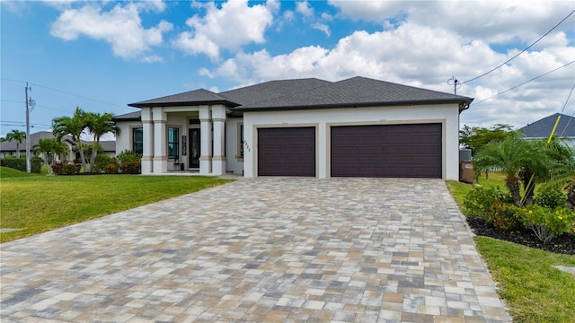3527 NW 8th Ter, Cape Coral, FL 33993 - prairie-style home featuring stucco siding, a garage, decorative driveway, and a front lawn