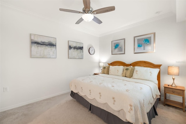 bedroom featuring light colored carpet, crown molding, baseboards, and a ceiling fan