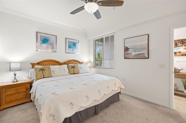 bedroom with light colored carpet, crown molding, ceiling fan, and baseboards