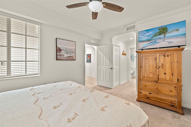 bedroom with light colored carpet, crown molding, ceiling fan, arched walkways, and baseboards