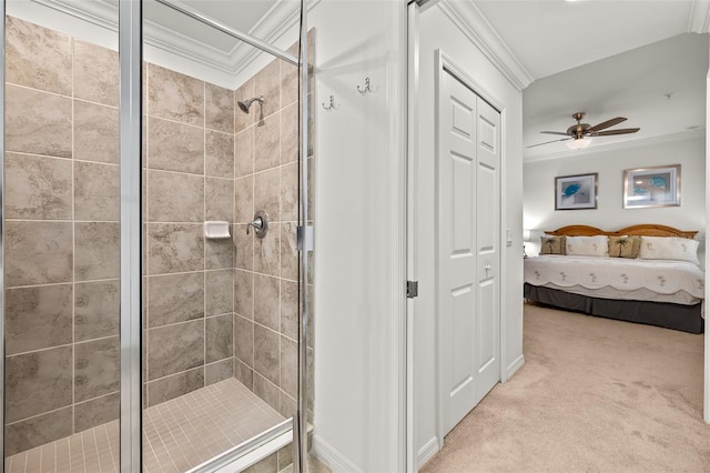ensuite bathroom with crown molding, a stall shower, and ceiling fan
