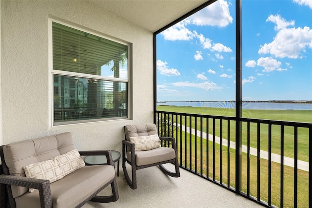 balcony featuring a water view