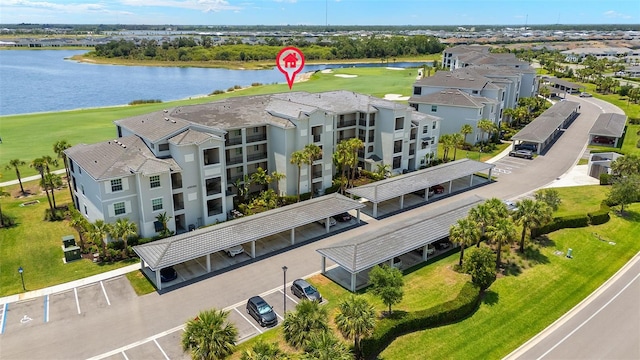 aerial view of a large body of water, a golf club, and apartment complex / building