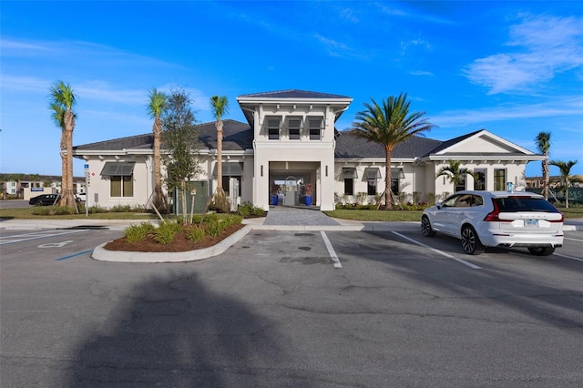 view of building exterior featuring uncovered parking