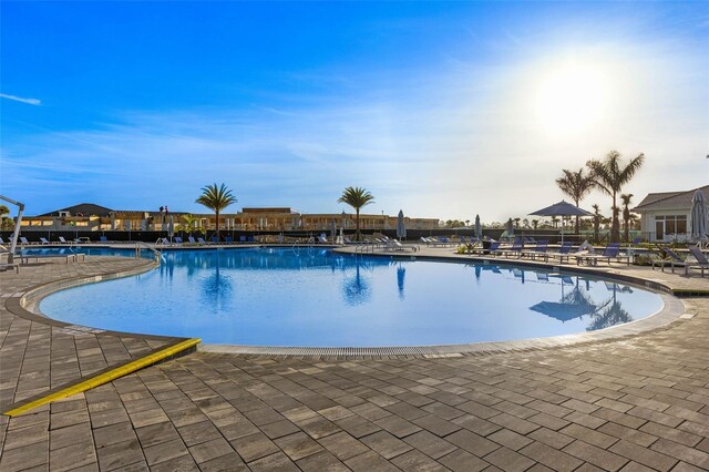 community pool featuring a patio area