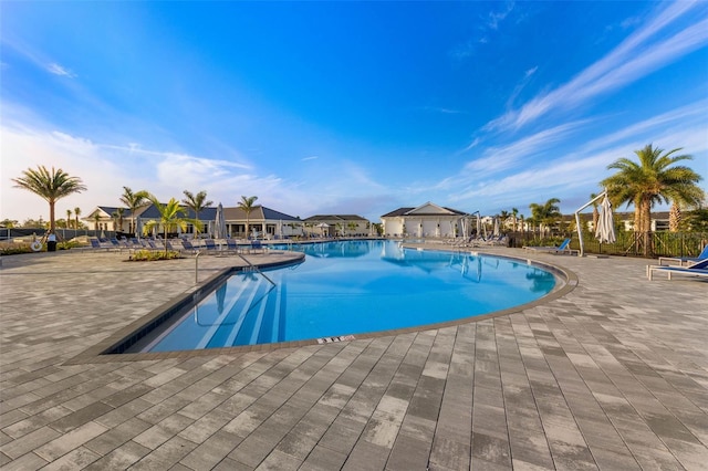 community pool with a patio area