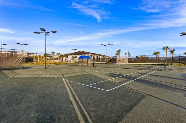 view of tennis court with fence