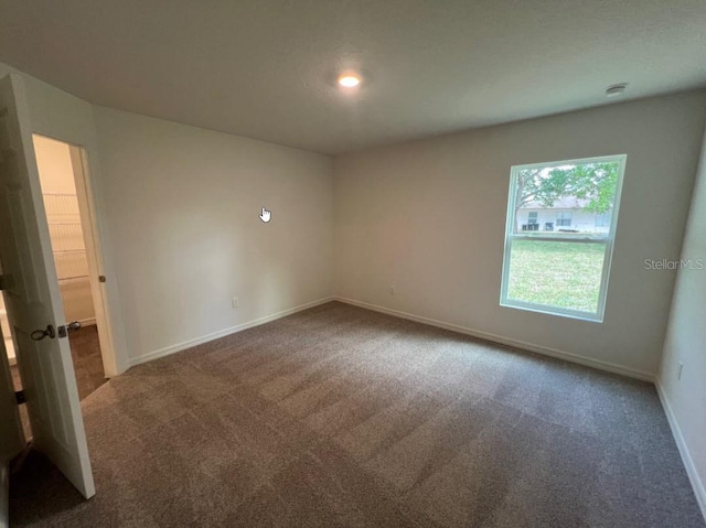 76 Raleigh Dr, Palm Coast, FL 32164 - spare room with carpet flooring, baseboards, and recessed lighting