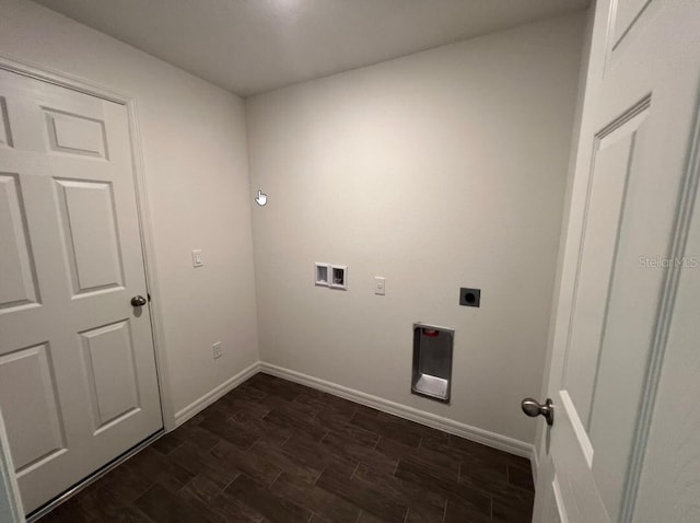 76 Raleigh Dr, Palm Coast, FL 32164 - laundry room with hookup for an electric dryer, baseboards, dark wood-style floors, and hookup for a washing machine