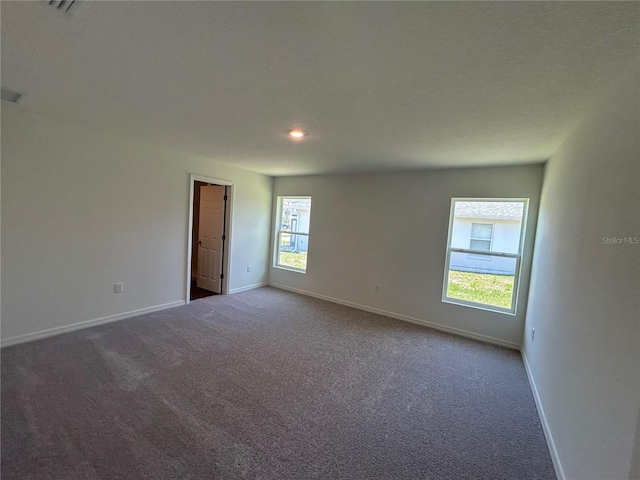6 Whittier Ln, Palm Coast, FL 32164 - carpeted spare room with baseboards