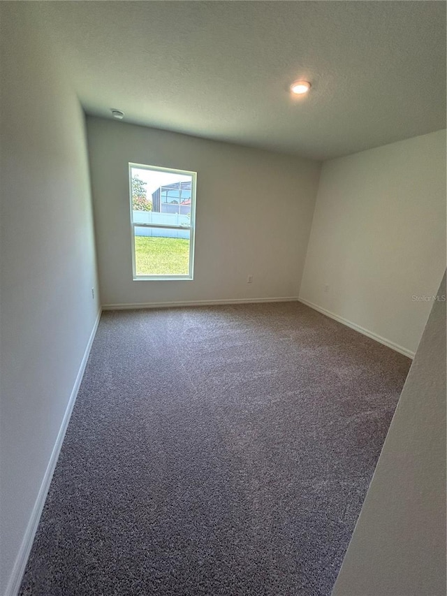 6 Whittier Ln, Palm Coast, FL 32164 - carpeted spare room with baseboards and recessed lighting