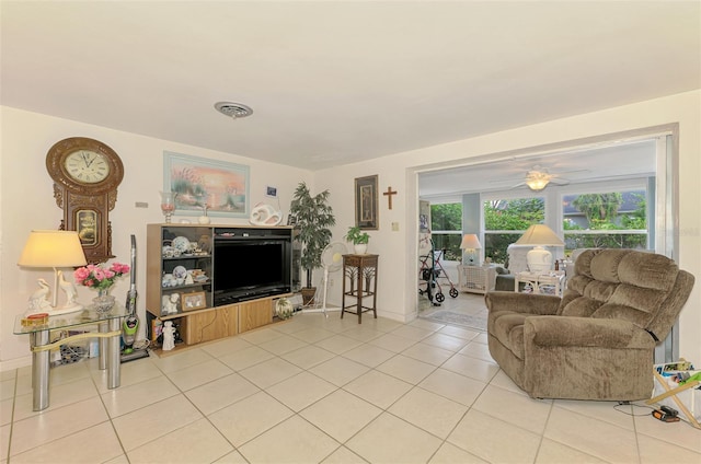 12018 Saragossa Ln, North Port, FL 34287 - tiled living area featuring a ceiling fan and baseboards