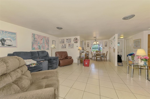 12018 Saragossa Ln, North Port, FL 34287 - living area featuring light tile patterned flooring and a chandelier