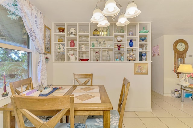 12018 Saragossa Ln, North Port, FL 34287 - tiled dining space featuring a chandelier
