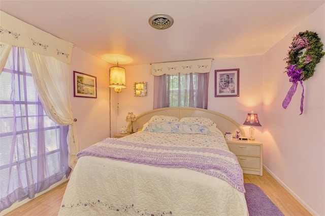 12018 Saragossa Ln, North Port, FL 34287 - bedroom featuring light wood-type flooring and baseboards