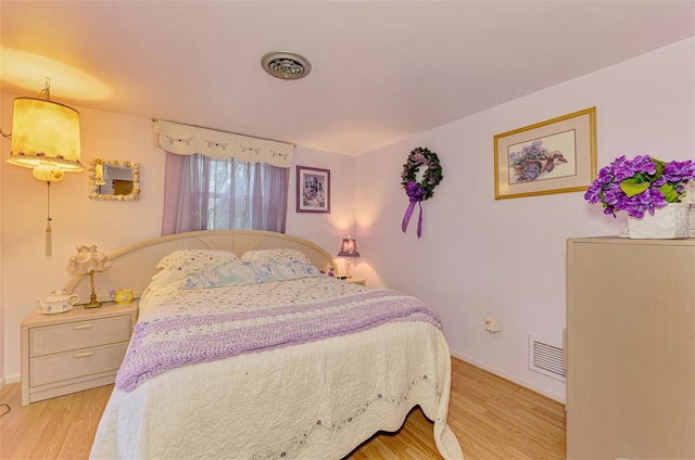 12018 Saragossa Ln, North Port, FL 34287 - bedroom featuring light wood-type flooring and baseboards
