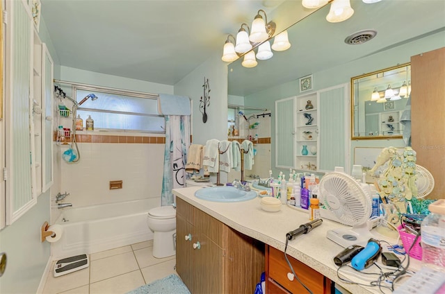 12018 Saragossa Ln, North Port, FL 34287 - full bathroom with tile patterned flooring, toilet, vanity, bathtub / shower combination, and a chandelier