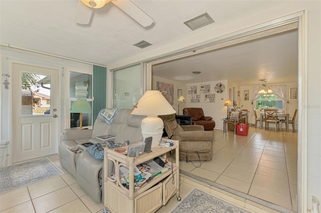 12018 Saragossa Ln, North Port, FL 34287 - living area with light tile patterned floors and ceiling fan