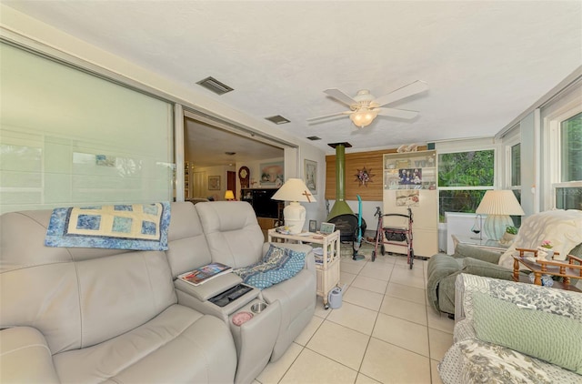 12018 Saragossa Ln, North Port, FL 34287 - sunroom / solarium featuring a wood stove