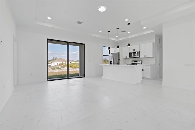 unfurnished living room featuring a tray ceiling, light marble finish floors, recessed lighting, and baseboards