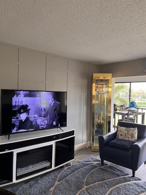 living room featuring a textured ceiling